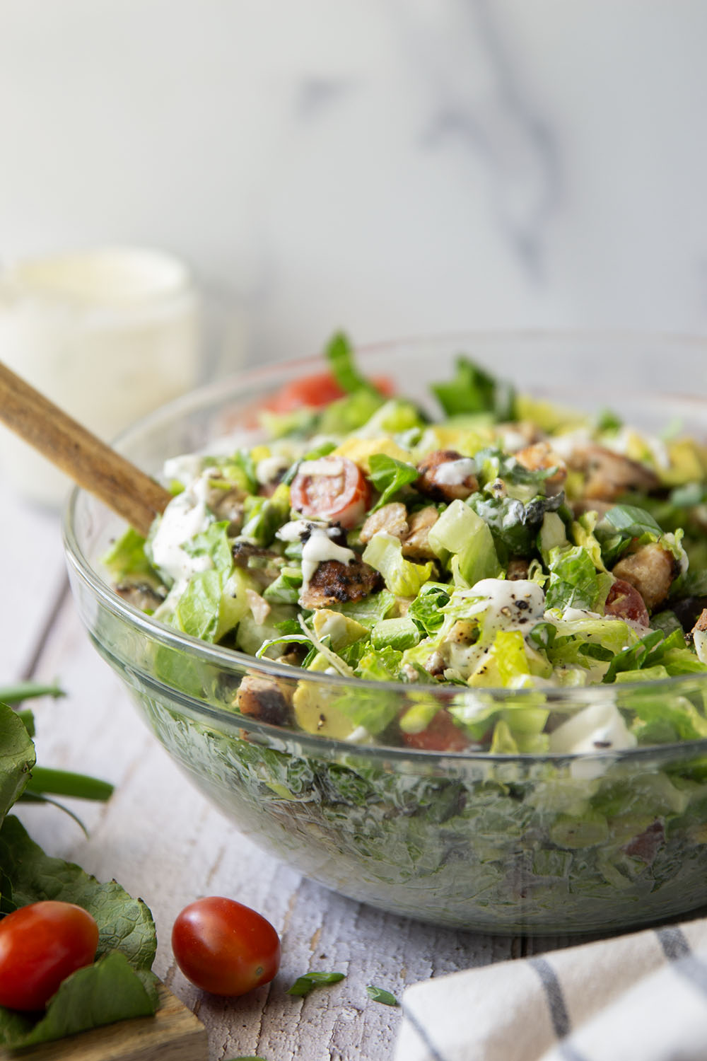 Smoky grilled chicken thighs, silky avocado cubes, cherry tomatoes, and a homemade buttermilk ranch dressing take this ranch chicken chopped salad to another level!
