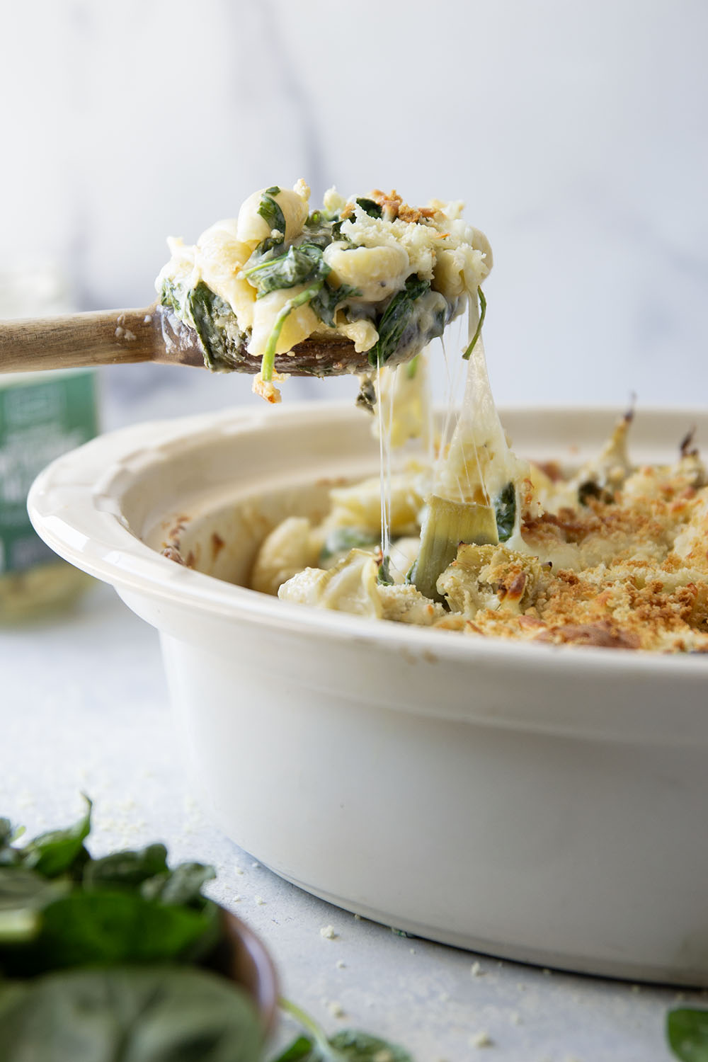 This spinach artichoke mac and cheese combines all the things you love about spinach artichoke dip in one comforting side dish! Packed with two kinds of cheese and lots of tender spinach and artichoke hearts.