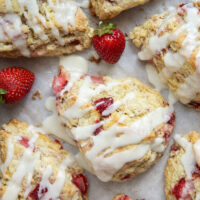 Loaded with little bursts of fresh strawberries and drizzled with a rich sweet cream glaze, these flaky strawberries and cream scones are always the most popular pastry on the table!