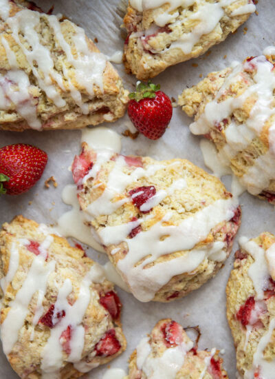 Loaded with little bursts of fresh strawberries and drizzled with a rich sweet cream glaze, these flaky strawberries and cream scones are always the most popular pastry on the table!
