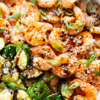 Grilled in spicy sweet chili sauce alongside tender zucchini cubes, this grilled sweet chili shrimp is a quick summer meal that's fantastic as an appetizer or served alongside rice.