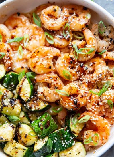 Grilled in spicy sweet chili sauce alongside tender zucchini cubes, this grilled sweet chili shrimp is a quick summer meal that's fantastic as an appetizer or served alongside rice.
