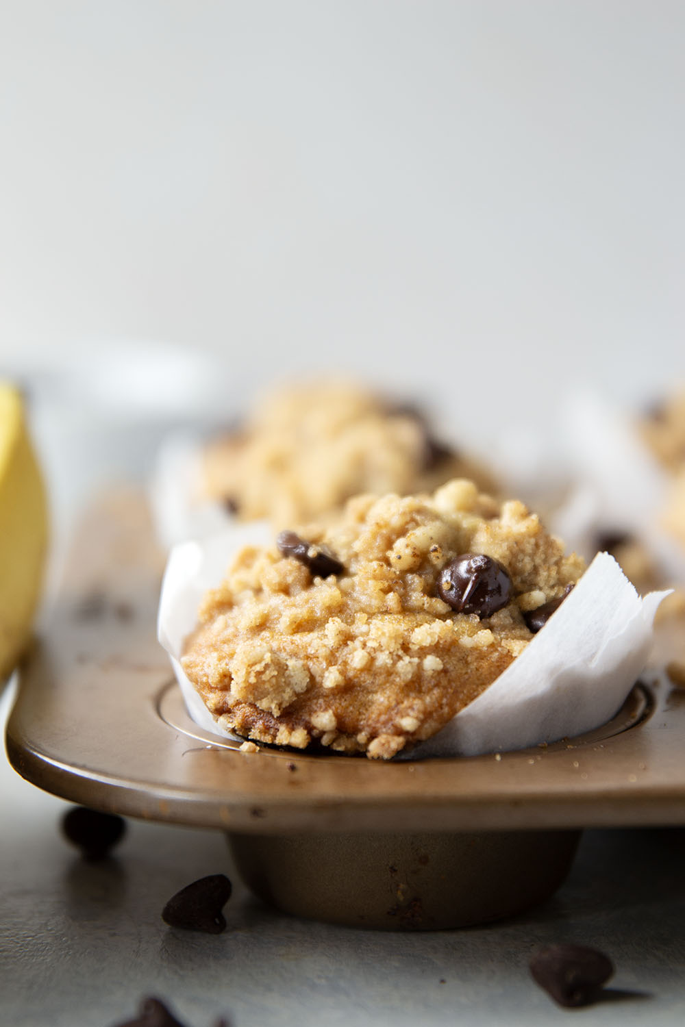 These banana chocolate chip muffins feature the texture you love about banana bread in muffin form along with lots of gooey chocolate and a to-die-for buttery streusel on top.