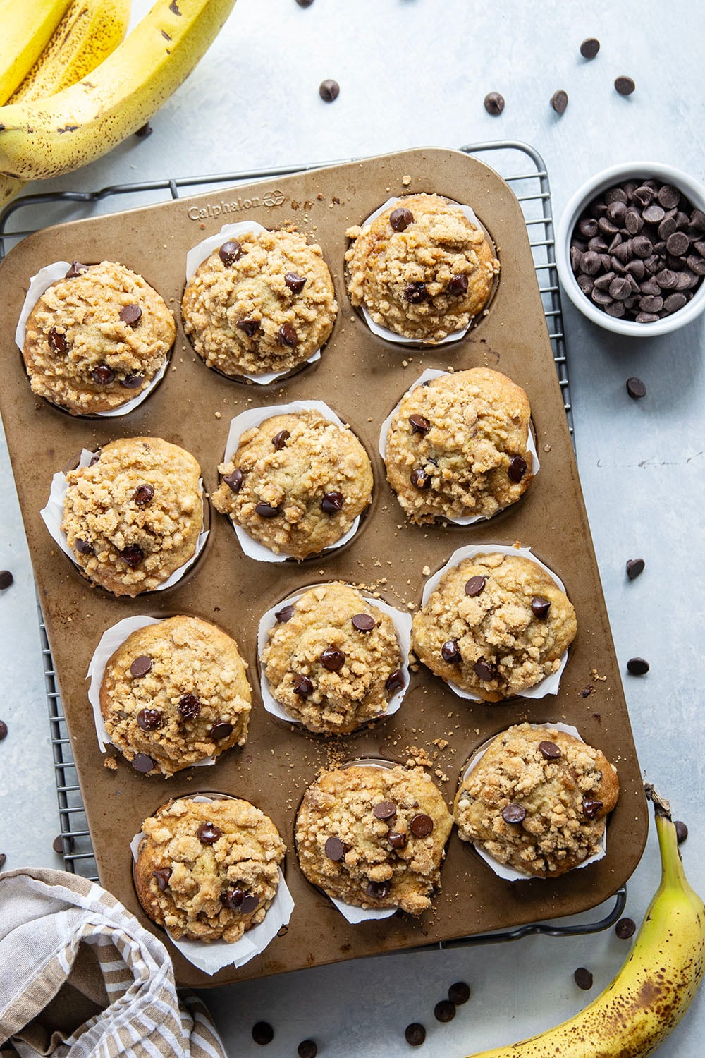 These banana chocolate chip muffins feature the texture you love about banana bread in muffin form along with lots of gooey chocolate and a to-die-for buttery streusel on top.