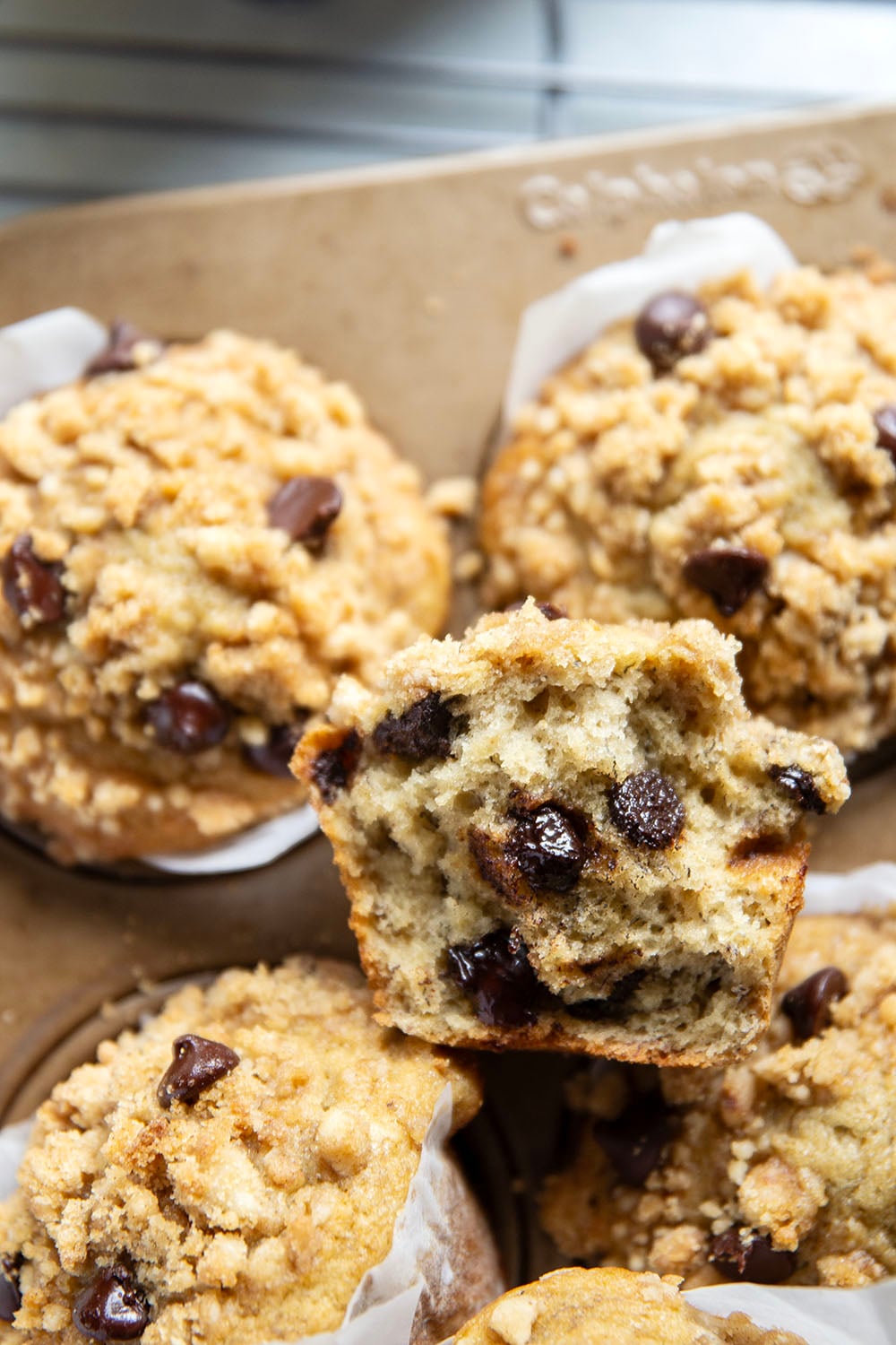 These banana chocolate chip muffins feature the texture you love about banana bread in muffin form along with lots of gooey chocolate and a to-die-for buttery streusel on top.