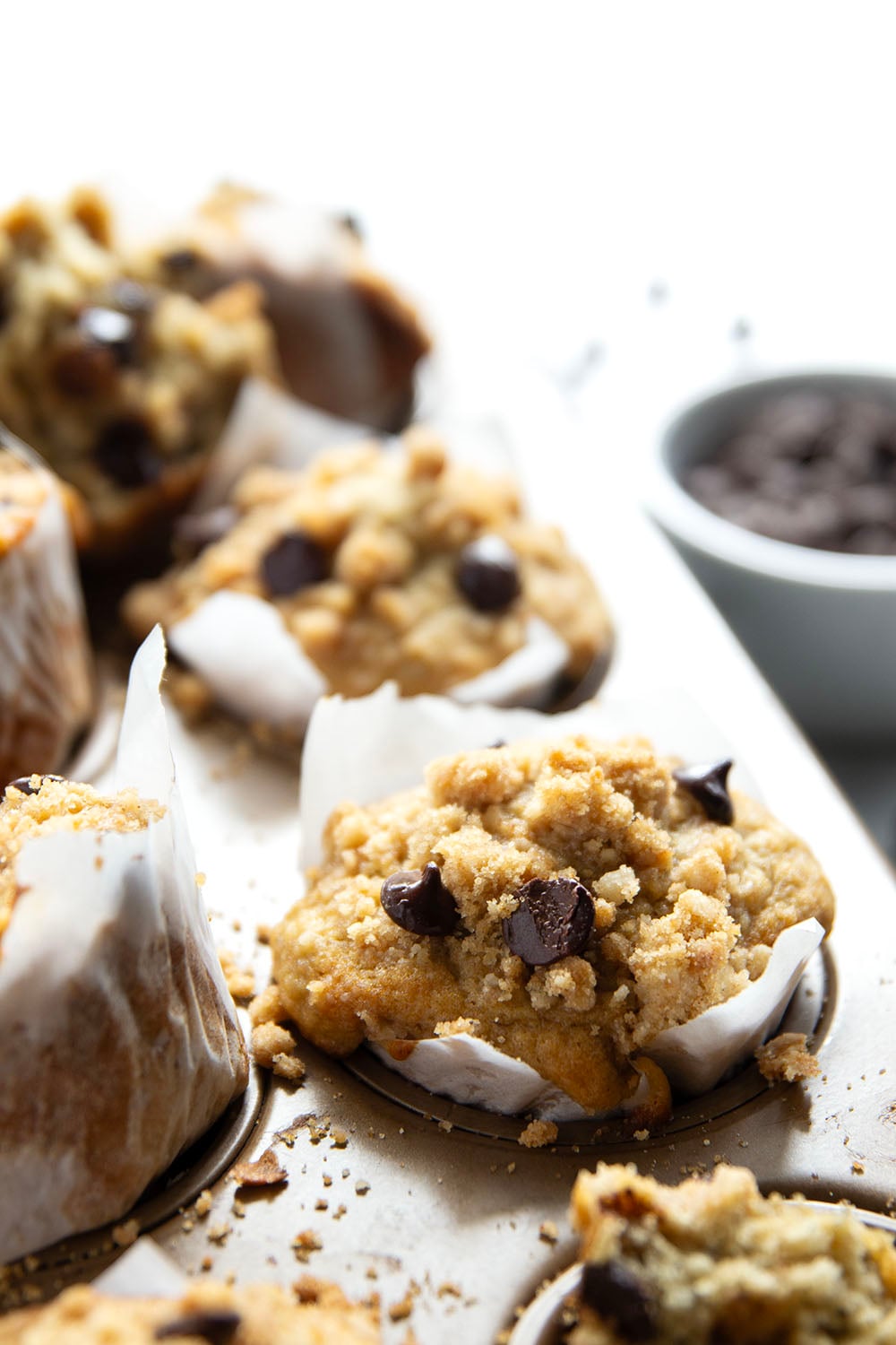 These banana chocolate chip muffins feature the texture you love about banana bread in muffin form along with lots of gooey chocolate and a to-die-for buttery streusel on top.