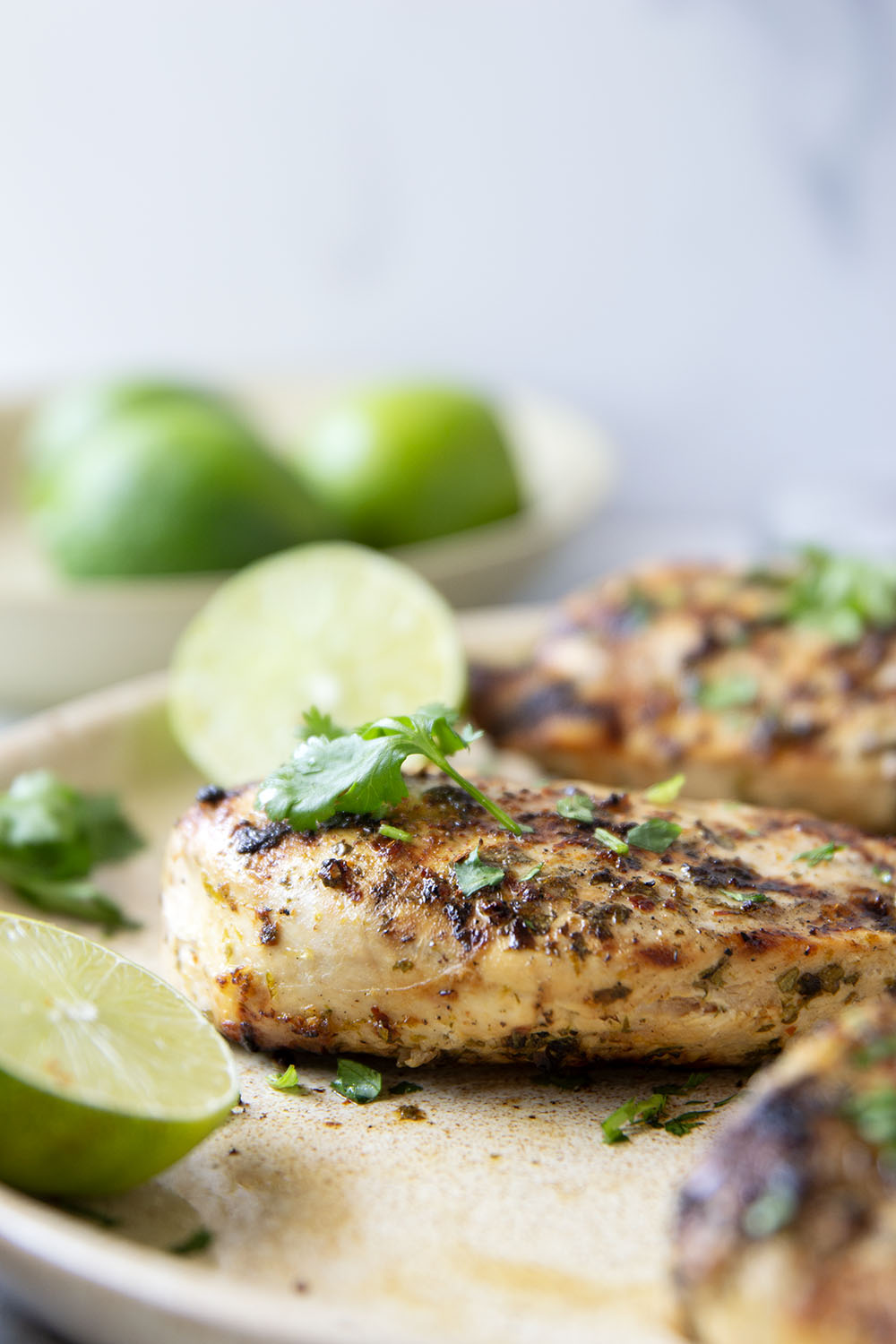 Marinated for hours in a flavorful fresh lime and cilantro marinade and then thrown on the grill, this grilled cilantro lime chicken is impossibly juicy and will quickly become a grill staple!
