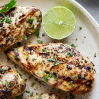 Marinated for hours in a flavorful fresh lime and cilantro marinade and then thrown on the grill, this grilled cilantro lime chicken is impossibly juicy and will quickly become a grill staple!