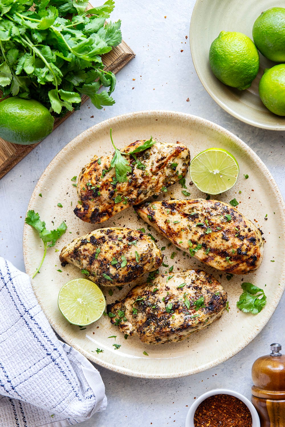 Marinated for hours in a flavorful fresh lime and cilantro marinade and then thrown on the grill, this grilled cilantro lime chicken is impossibly juicy and will quickly become a grill staple!