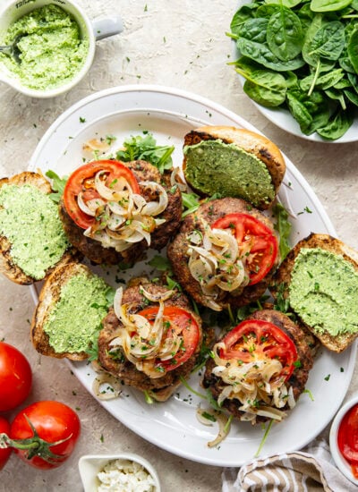 These feta turkey burgers have the ultimate juicy texture! A silky spinach whipped feta and plenty of grilled onions take them over the top.