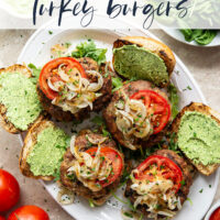 These feta turkey burgers have the ultimate juicy texture! A silky spinach whipped feta and plenty of grilled onions take them over the top.