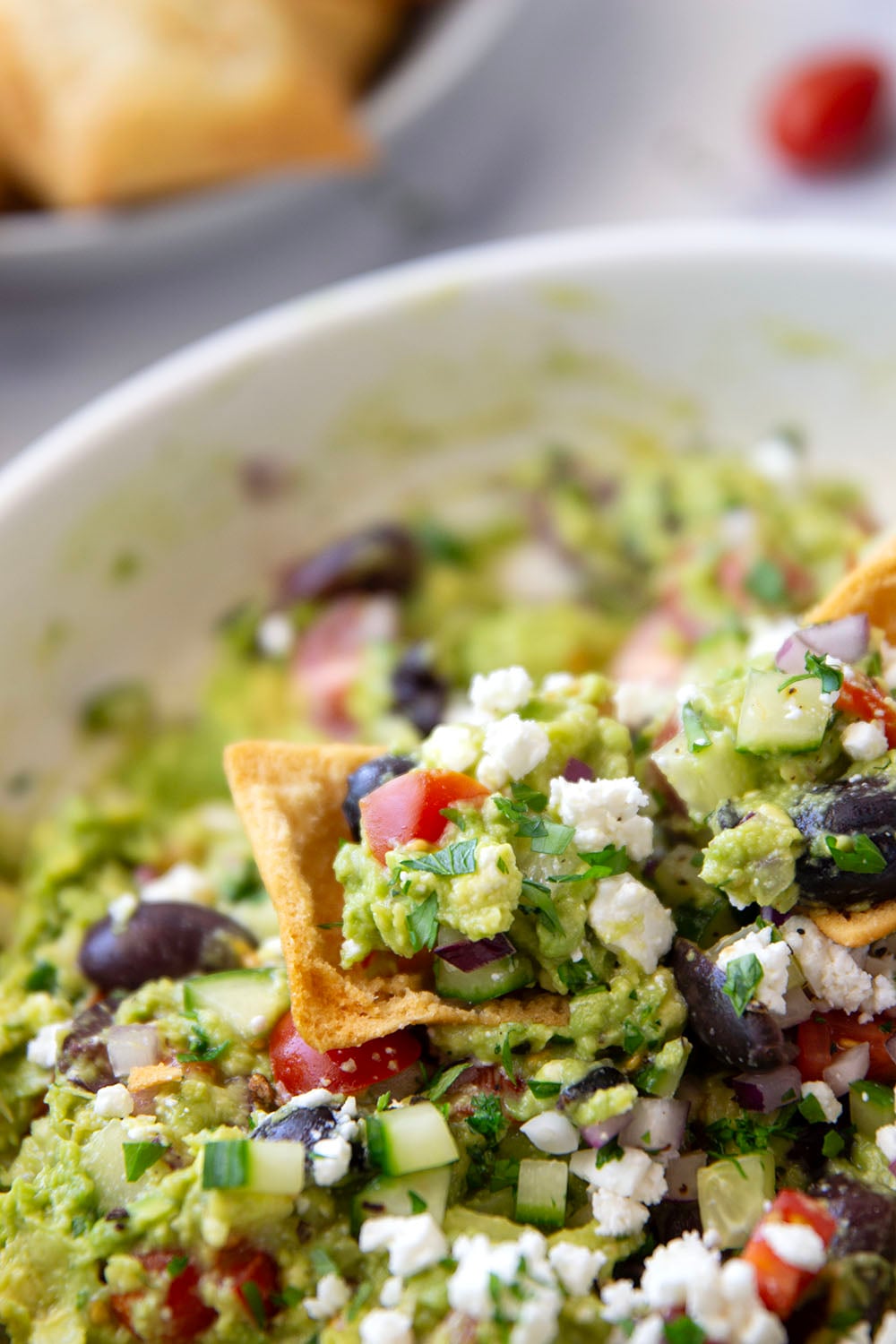 Packed with fresh Greek-inspired ingredients and ready in minutes, this Greek guacamole is unbelievably fresh-tasting and goes great with pita chips for dipping.