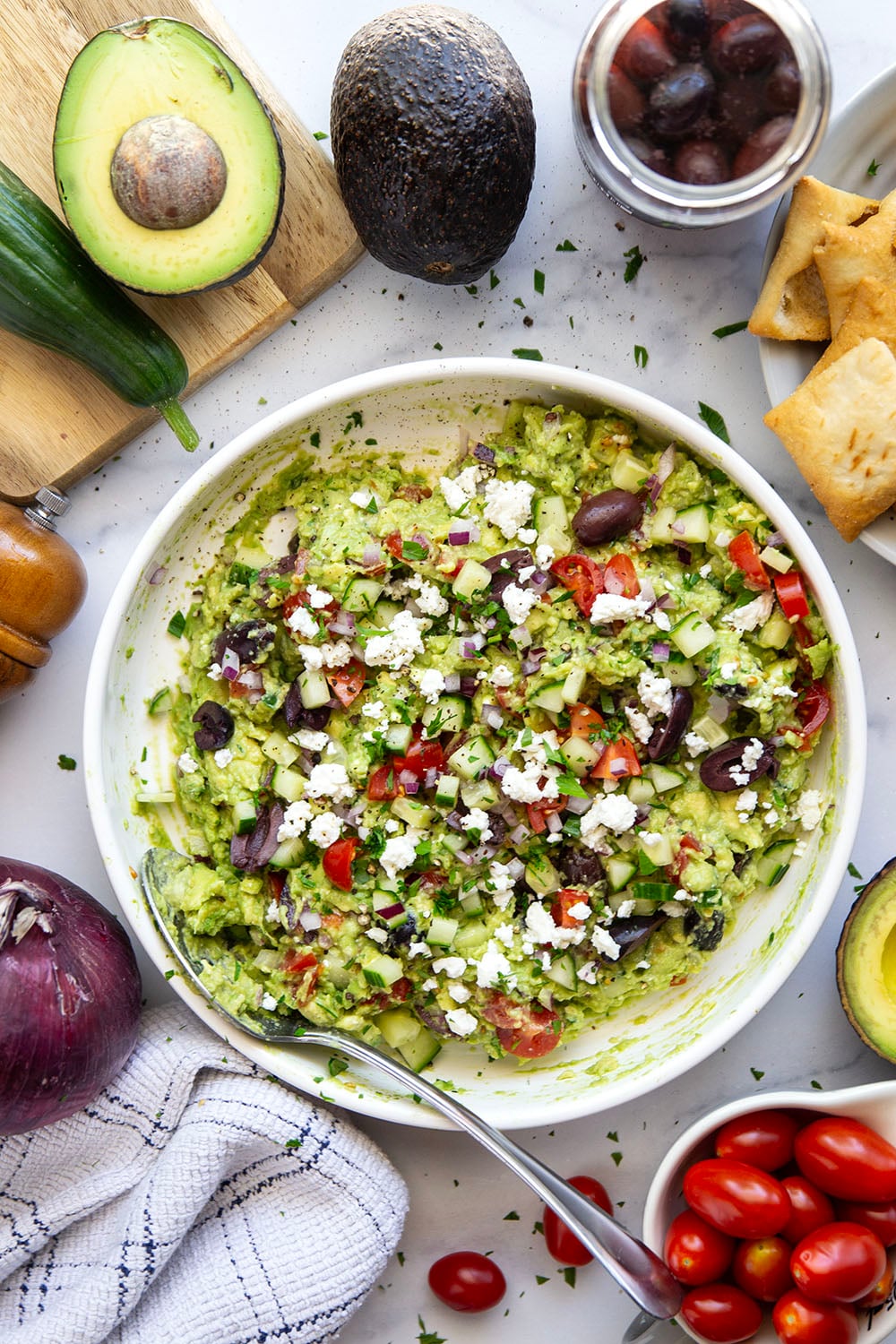 Packed with fresh Greek-inspired ingredients and ready in minutes, this Greek guacamole is unbelievably fresh-tasting and goes great with pita chips for dipping.