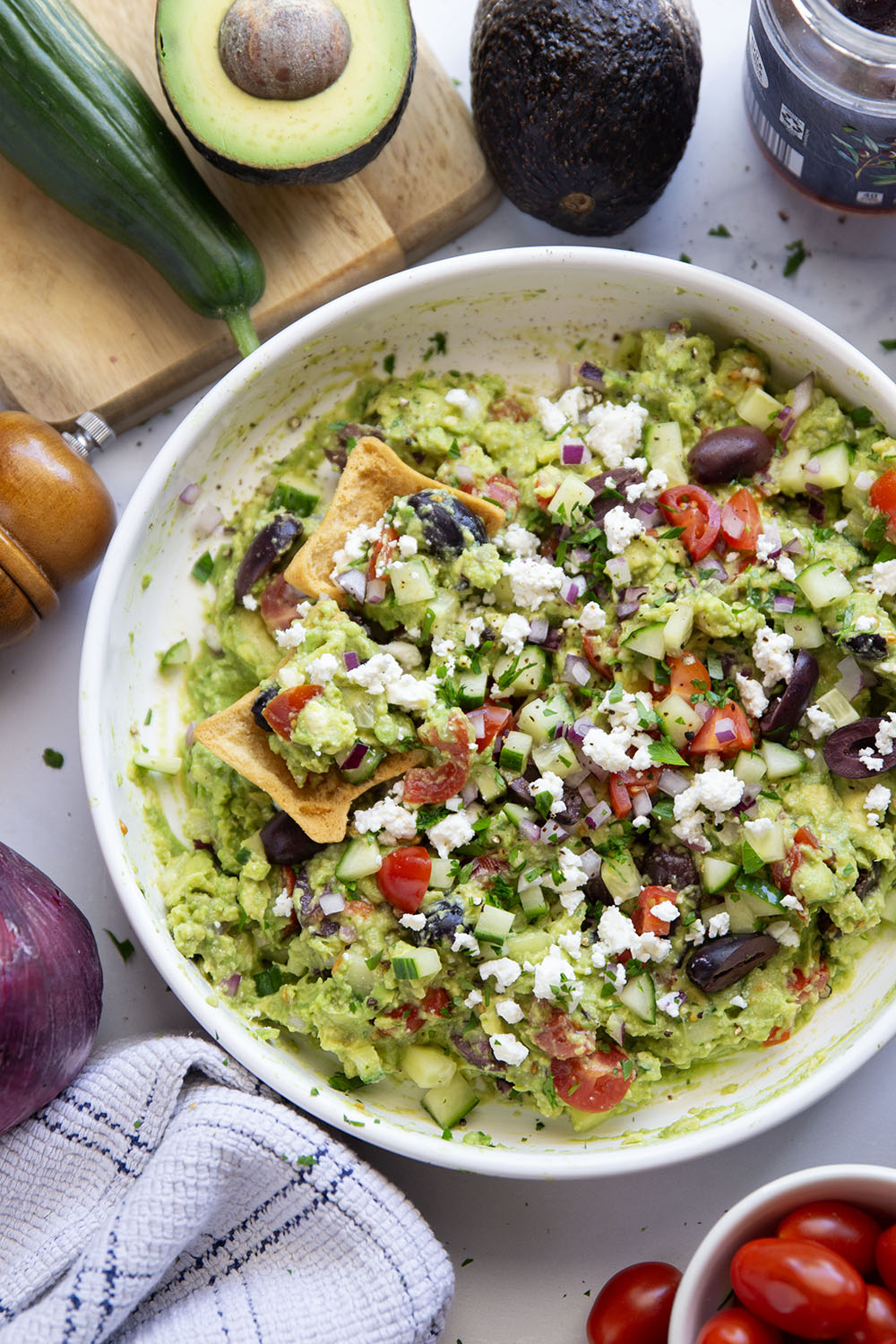 Packed with fresh Greek-inspired ingredients and ready in minutes, this Greek guacamole is unbelievably fresh-tasting and goes great with pita chips for dipping.