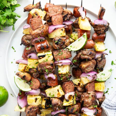 This is one summer kabob recipe that you're gonna want to hold onto forever! Sweet and spicy jerk-rubbed chicken pairs with juicy sausage, sweet pineapple, and tender red onion.