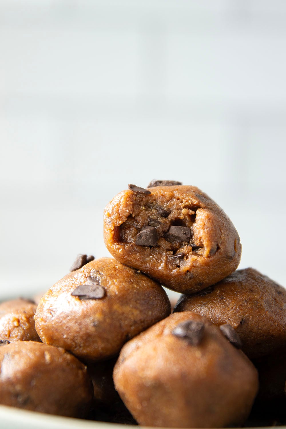 These almond butter cookie dough bites taste exactly like real cookie dough and feature a base of creamy almond butter and lots of chocolate chunks. Completely no-bake and lower in sugar!