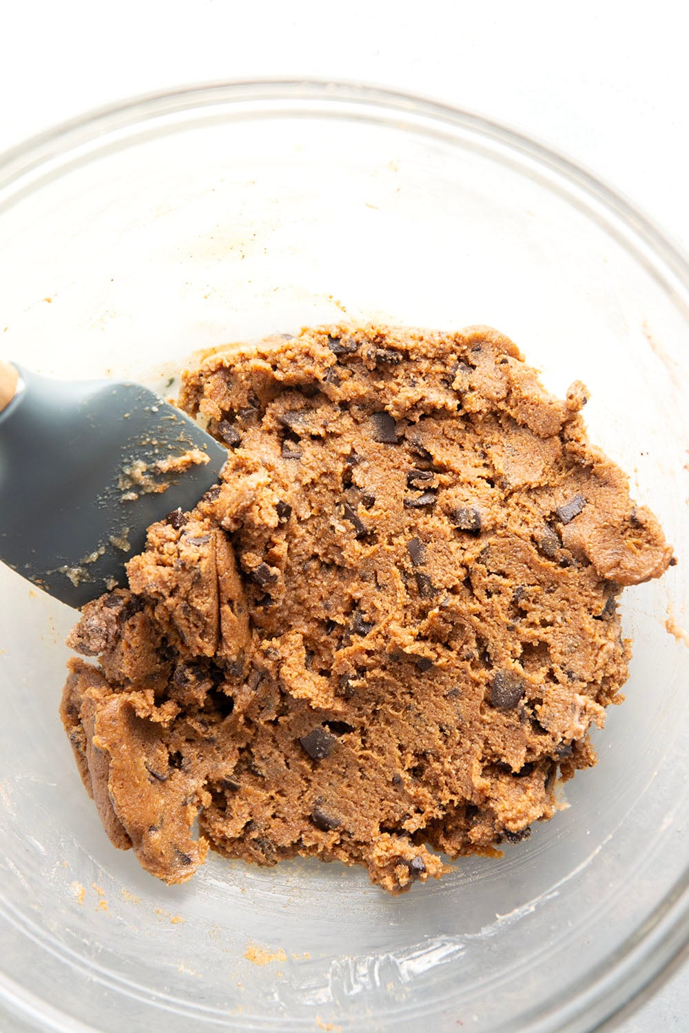 These almond butter cookie dough bites taste exactly like real cookie dough and feature a base of creamy almond butter and lots of chocolate chunks. Completely no-bake and lower in sugar!