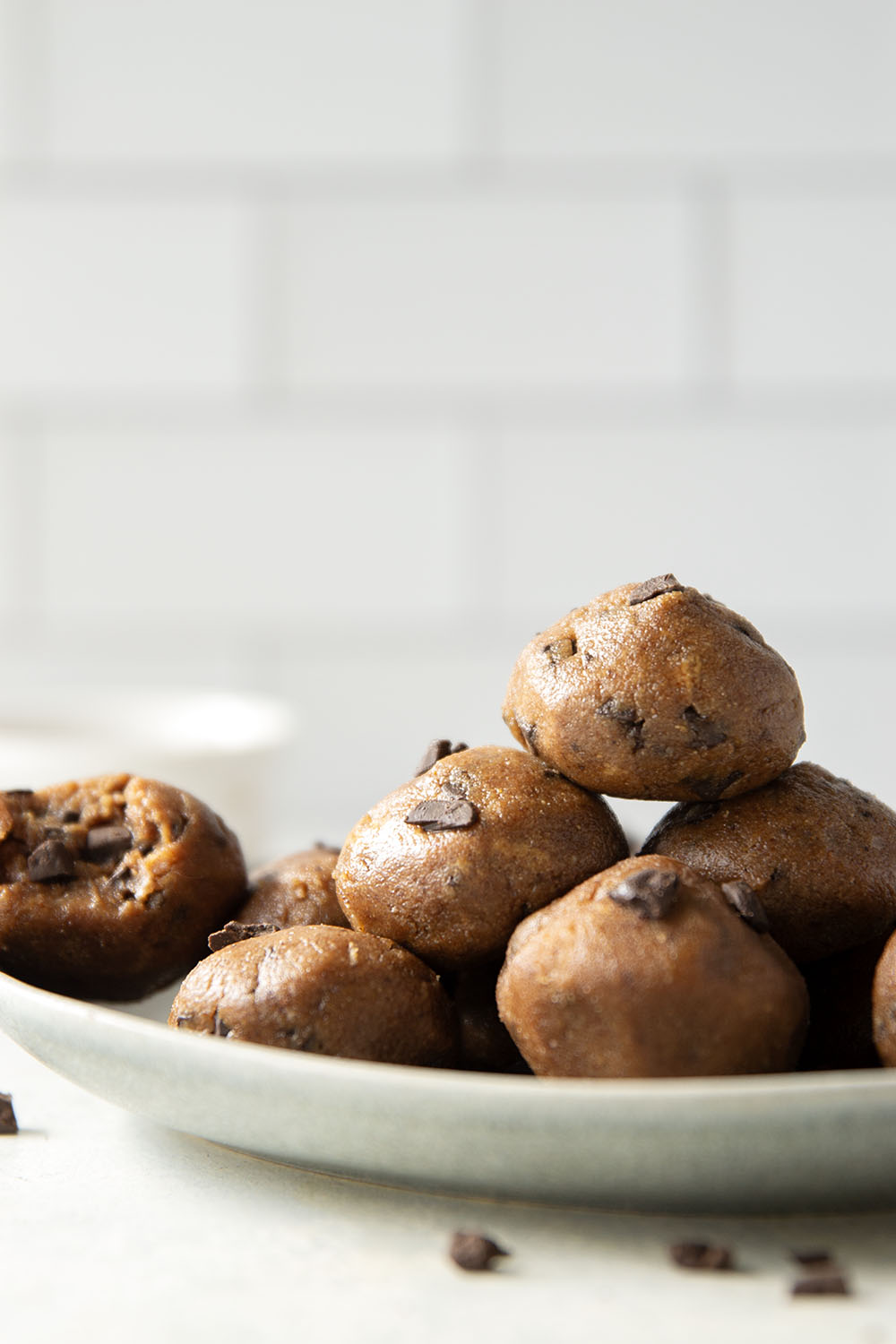 These almond butter cookie dough bites taste exactly like real cookie dough and feature a base of creamy almond butter and lots of chocolate chunks. Completely no-bake and lower in sugar!