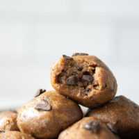 These almond butter cookie dough bites taste exactly like real cookie dough and feature a base of creamy almond butter and lots of chocolate chunks. Completely no-bake and lower in sugar!