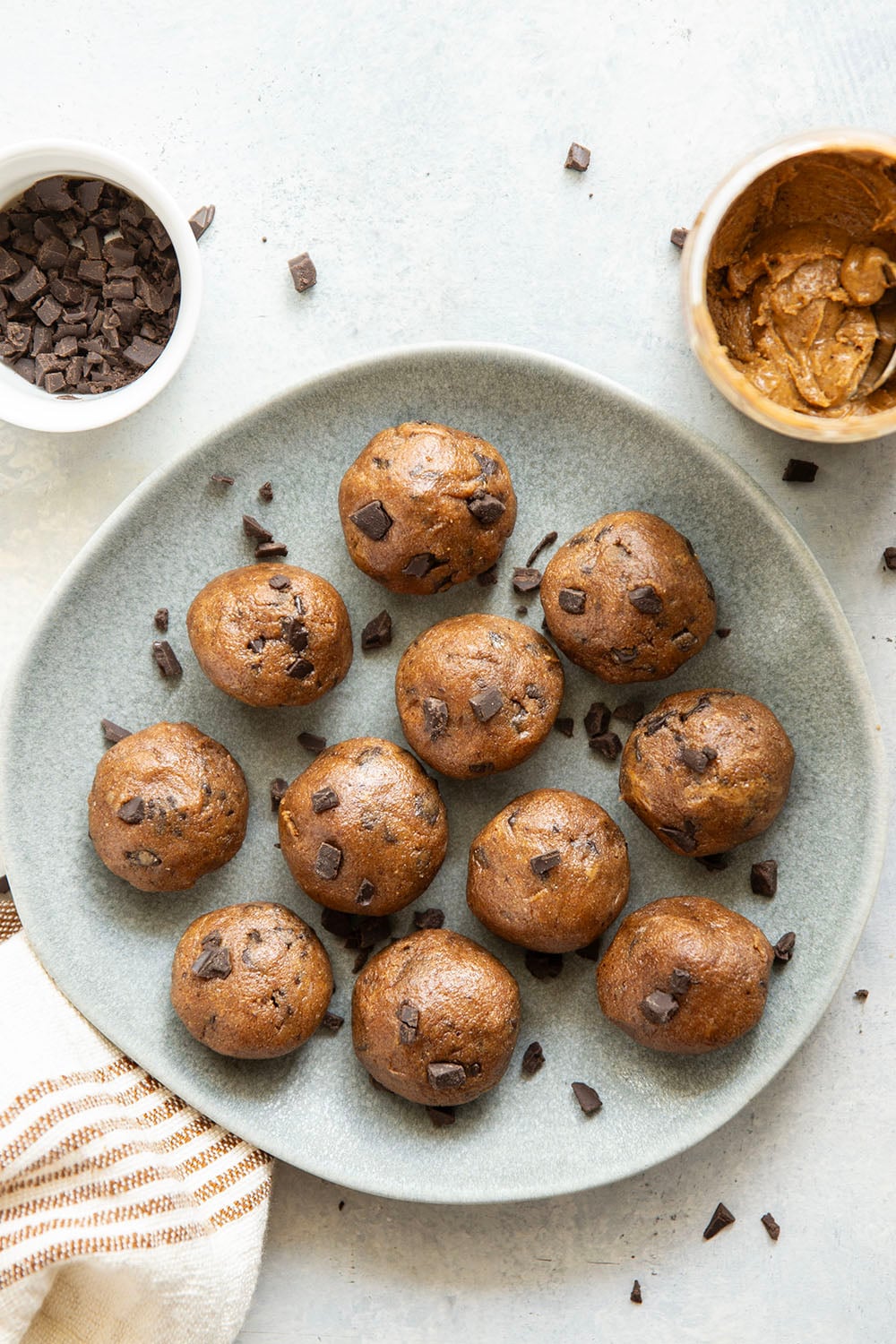 These almond butter cookie dough bites taste exactly like real cookie dough and feature a base of creamy almond butter and lots of chocolate chunks. Completely no-bake and lower in sugar!