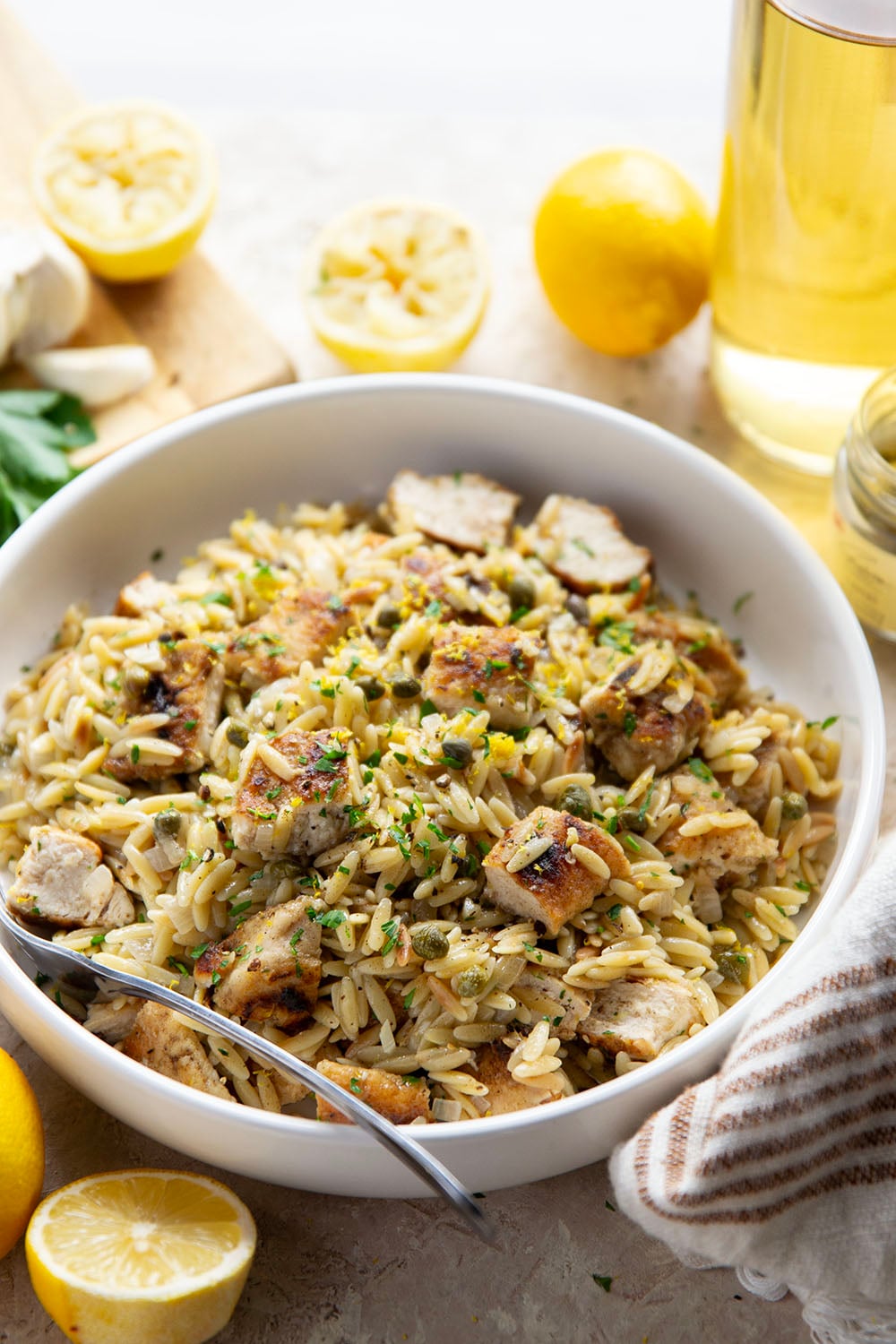 If you love classic restaurant chicken piccata, you'll love this easy one-pot chicken piccata orzo that features lots of fresh lemon, flavorful white wine, and tangy capers in a fluffy orzo base.