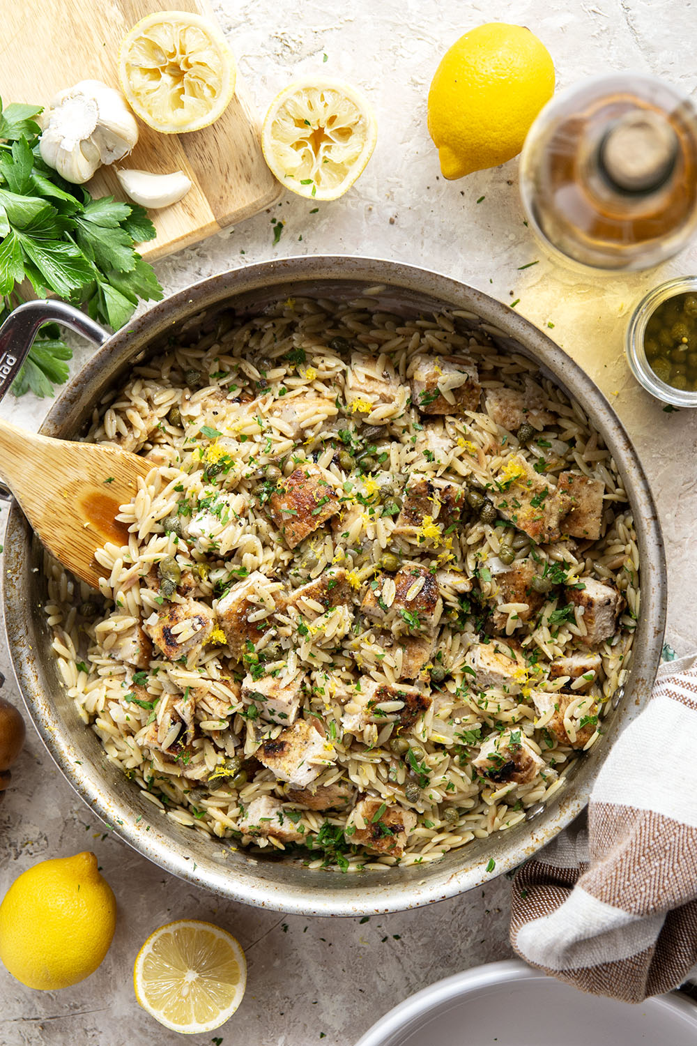 If you love classic restaurant chicken piccata, you'll love this easy one-pot chicken piccata orzo that features lots of fresh lemon, flavorful white wine, and tangy capers in a fluffy orzo base.