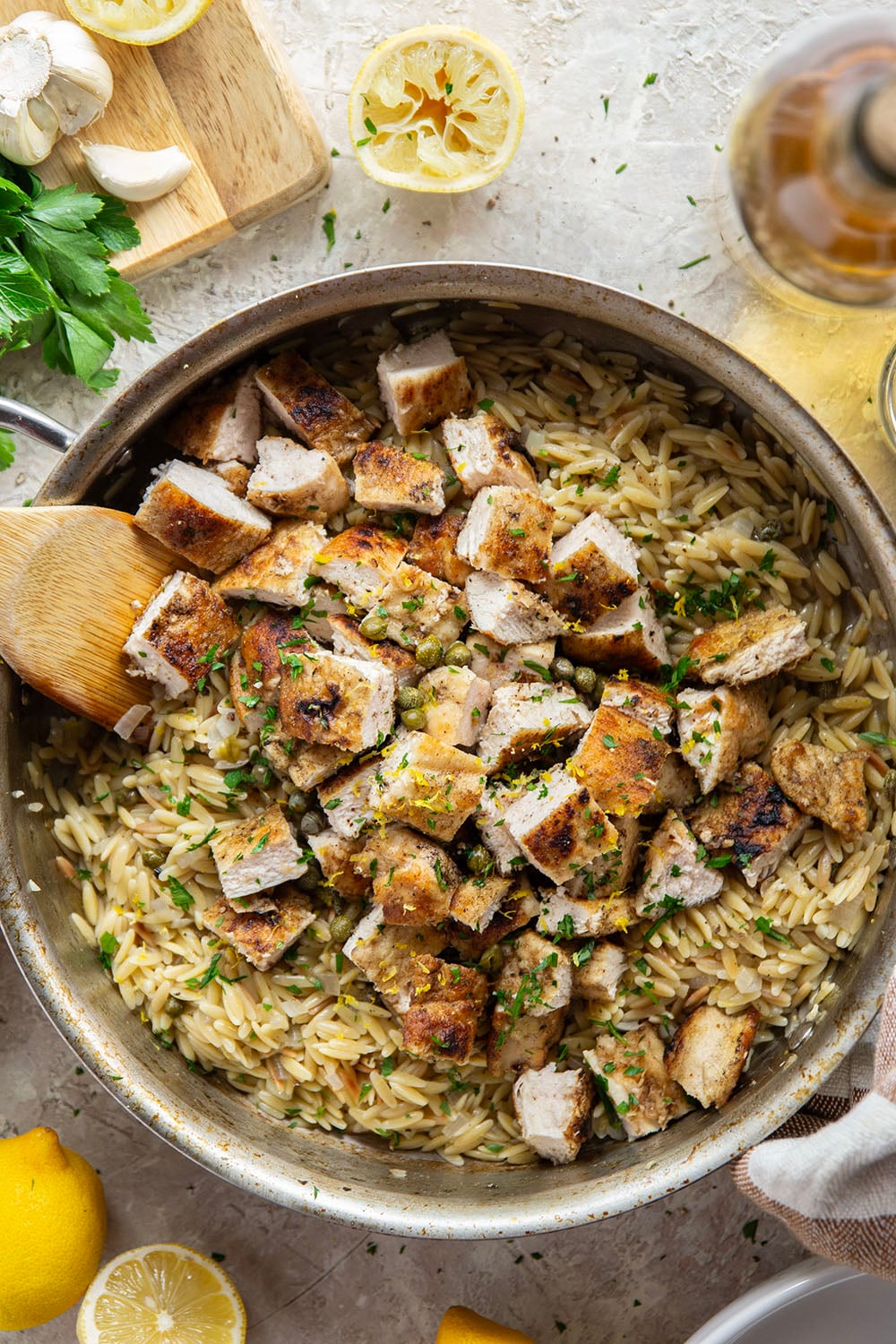 If you love classic restaurant chicken piccata, you'll love this easy one-pot chicken piccata orzo that features lots of fresh lemon, flavorful white wine, and tangy capers in a fluffy orzo base.