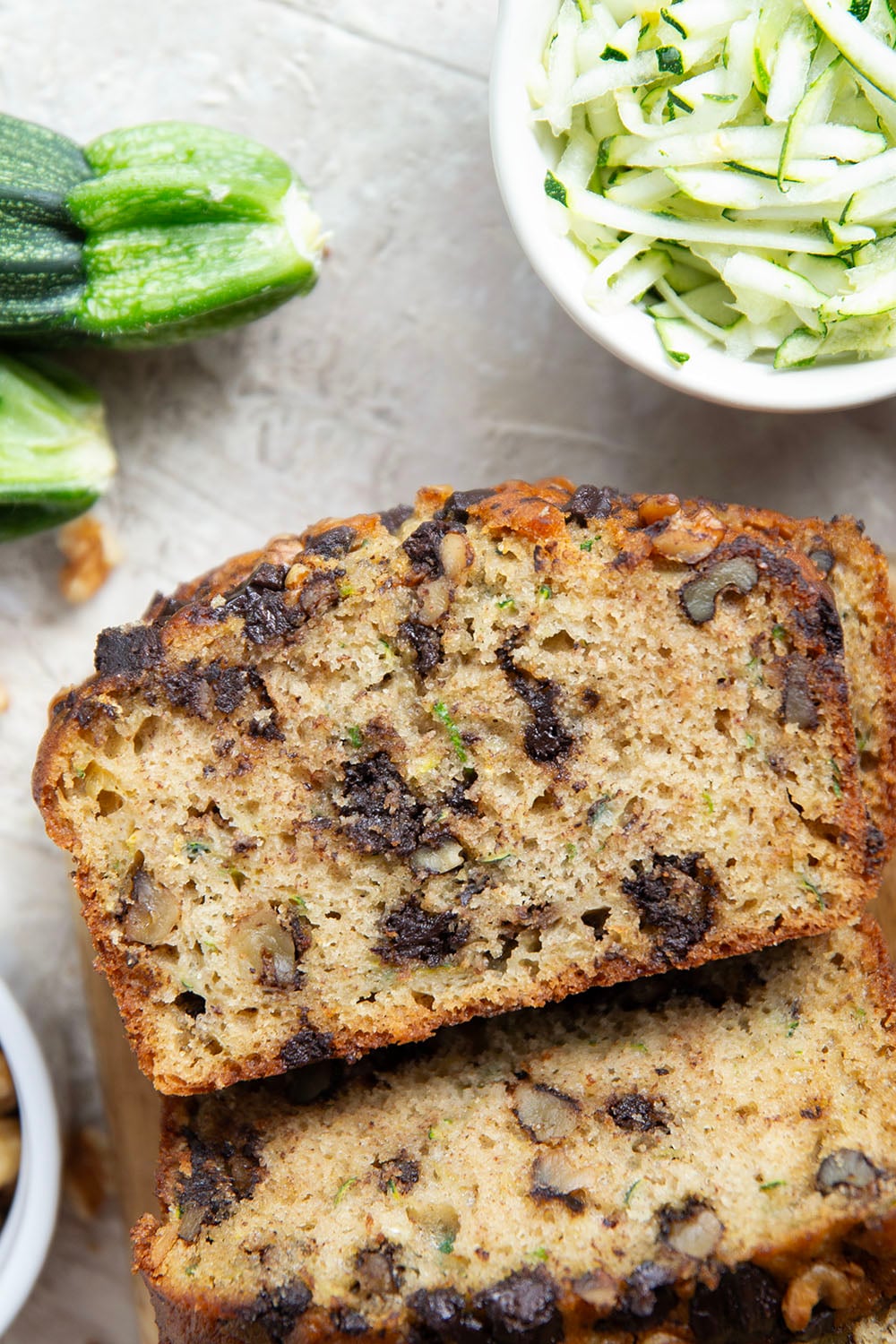 This dark chocolate zucchini bread is so moist and exploding with gooey dark chocolate chunks, you won't believe it's on the healthier side!