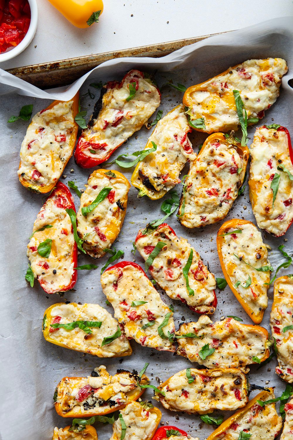Stuffed with three different kinds of cheese and lots of pimentos, these sweet pepper poppers are grilled until perfectly smoky and the most addicting summer appetizer!