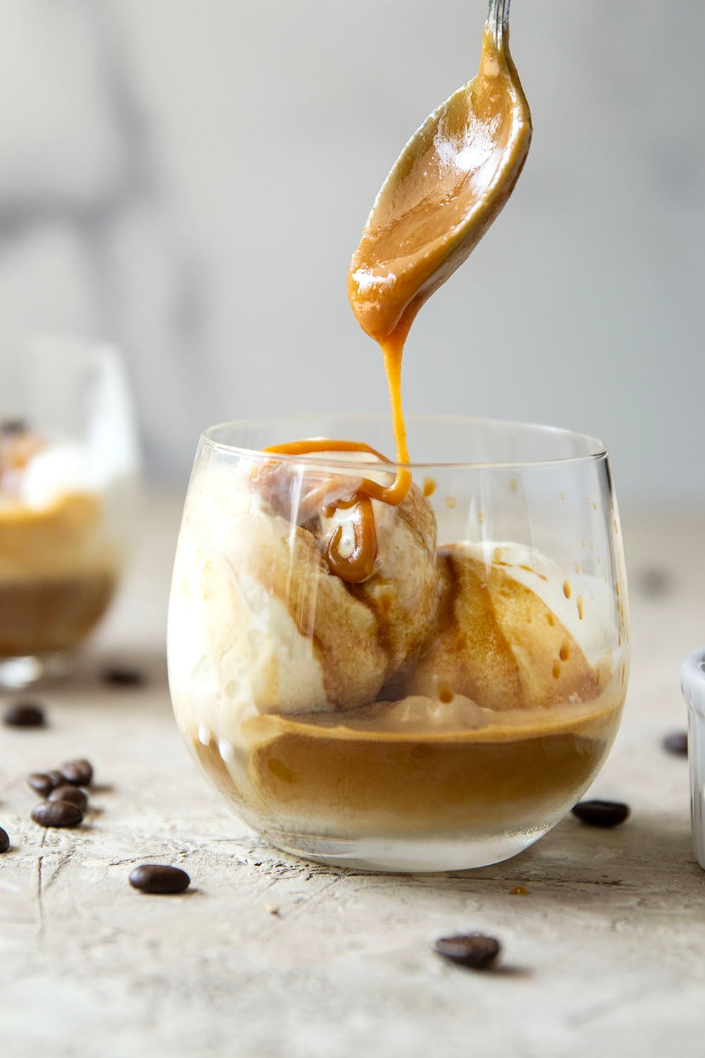 Drizzles of homemade salted caramel sauce, rich espresso, and creamy vanilla ice cream come together in this salted caramel affogato.