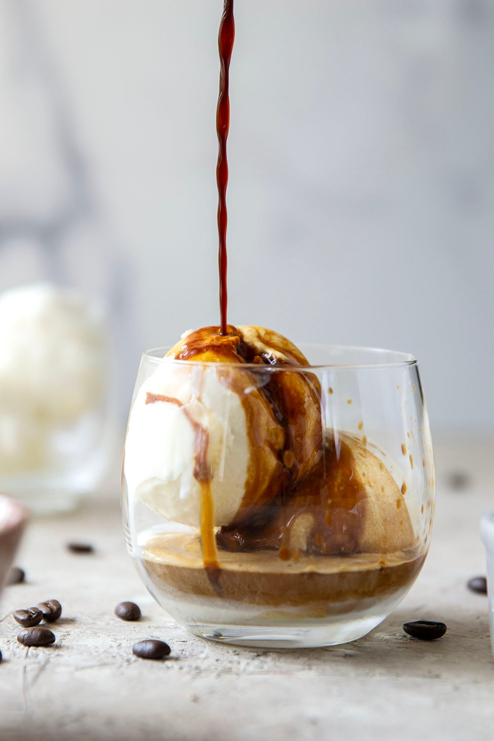 Drizzles of homemade salted caramel sauce, rich espresso, and creamy vanilla ice cream come together in this salted caramel affogato.
