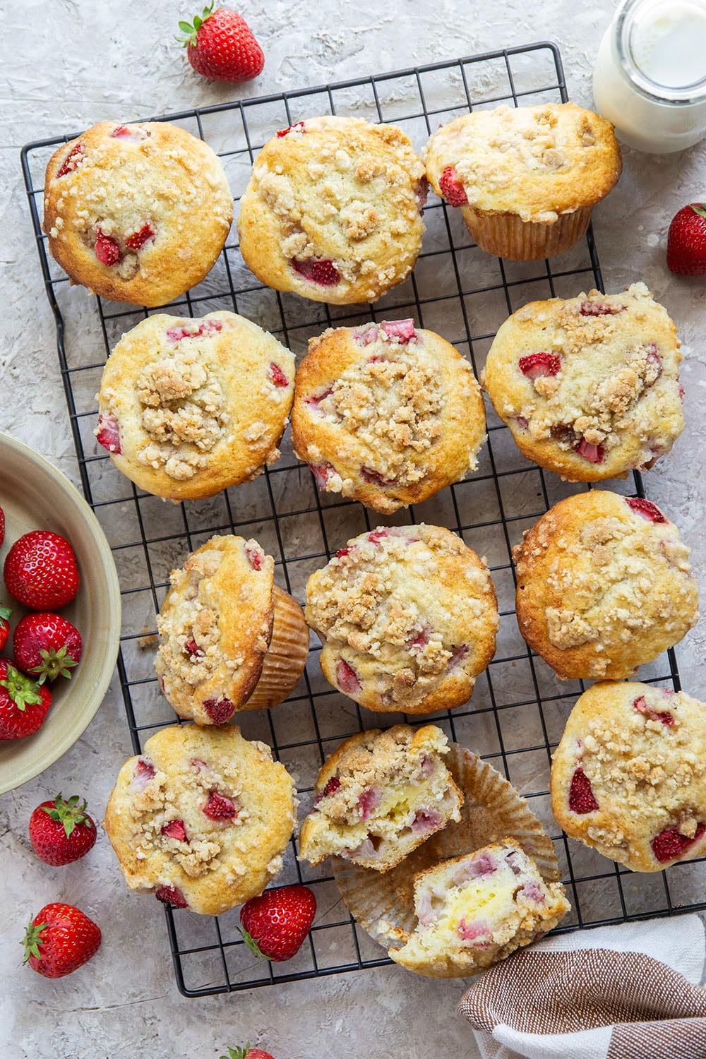 Packed with juicy strawberries, filled with a luscious cheesecake filling, and topped with a buttery crumb topping, these strawberry cheesecake muffins are the best of all worlds wrapped up into one muffin.