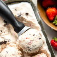Churned with a fresh strawberry sauce and lots of chocolate chip pieces, this strawberry chocolate chip ice cream is dreamy with fresh summer strawberries!