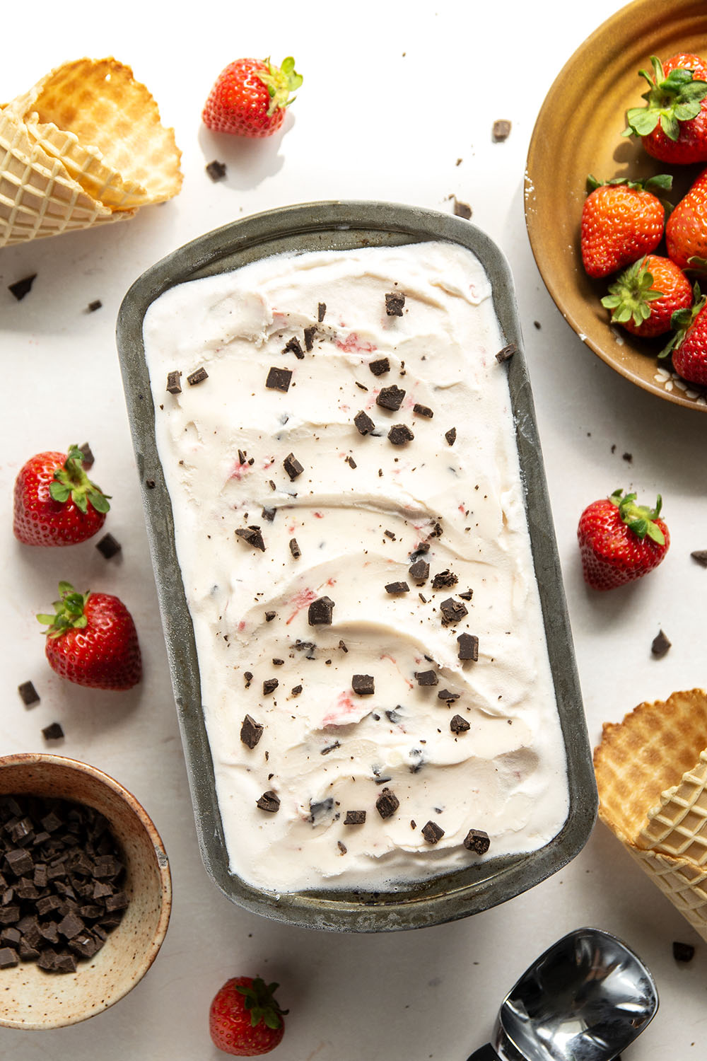 Churned with a fresh strawberry sauce and lots of chocolate chip pieces, this strawberry chocolate chip ice cream is dreamy with fresh summer strawberries!
