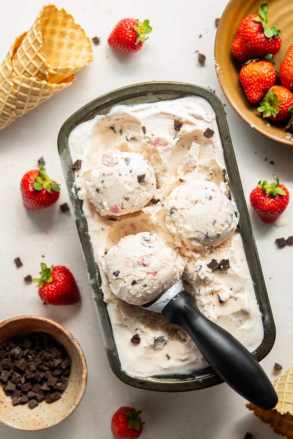 Churned with a fresh strawberry sauce and lots of chocolate chip pieces, this strawberry chocolate chip ice cream is dreamy with fresh summer strawberries!