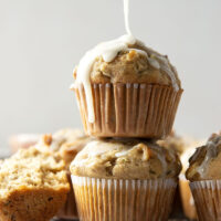 Perfectly spiced and drizzled with a creamy vanilla glaze, these zucchini banana muffins are extra moist from both mashed banana and shredded zucchini.