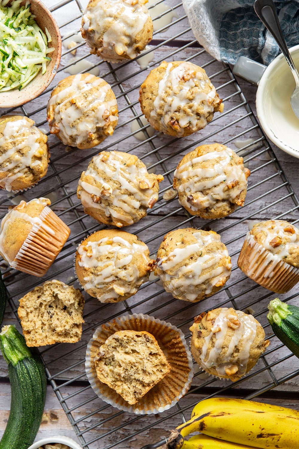 Perfectly spiced and drizzled with a creamy vanilla glaze, these zucchini banana muffins are extra moist from both mashed banana and shredded zucchini.
