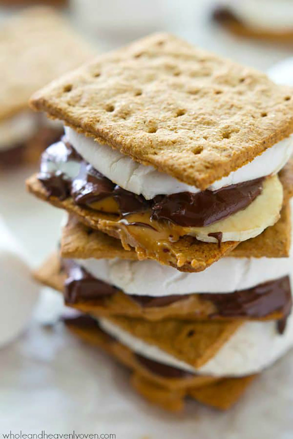 Layered with banana slices, creamy peanut butter, gooey chocolate, and toasted marshmallows, no one will be able to resist these peanut butter banana s'mores!
