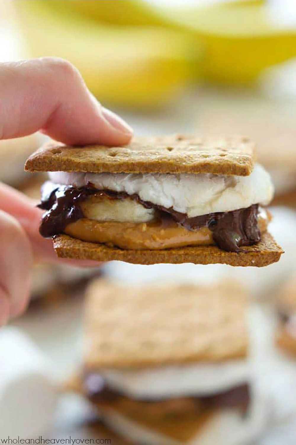 Layered with banana slices, creamy peanut butter, gooey chocolate, and toasted marshmallows, no one will be able to resist these peanut butter banana s'mores!