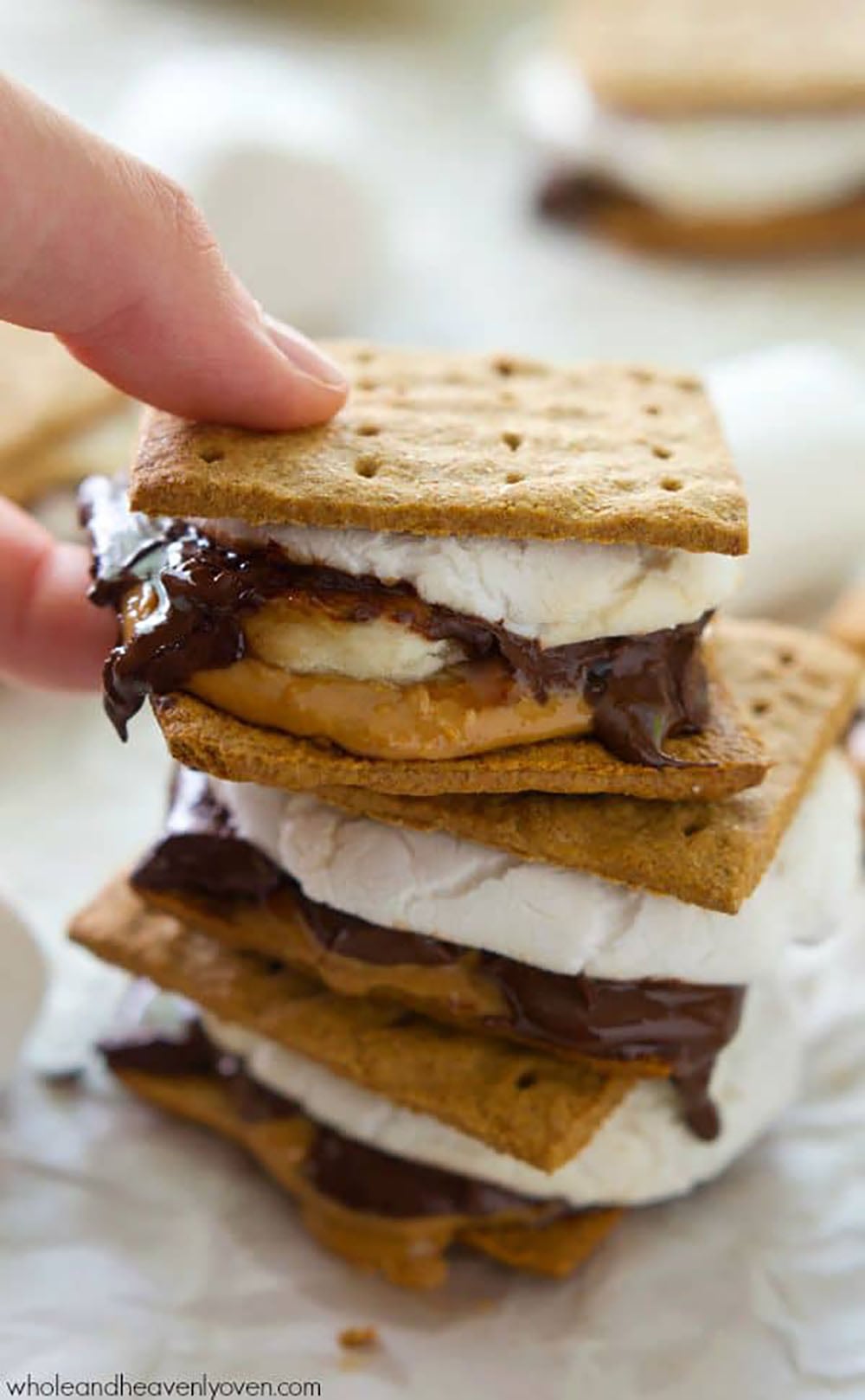 Layered with banana slices, creamy peanut butter, gooey chocolate, and toasted marshmallows, no one will be able to resist these peanut butter banana s'mores!