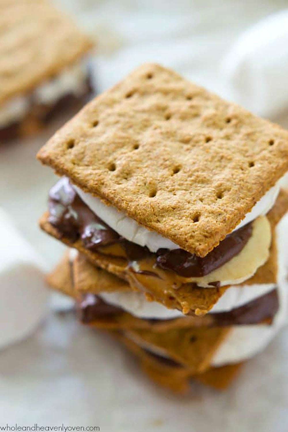 Layered with banana slices, creamy peanut butter, gooey chocolate, and toasted marshmallows, no one will be able to resist these peanut butter banana s'mores!