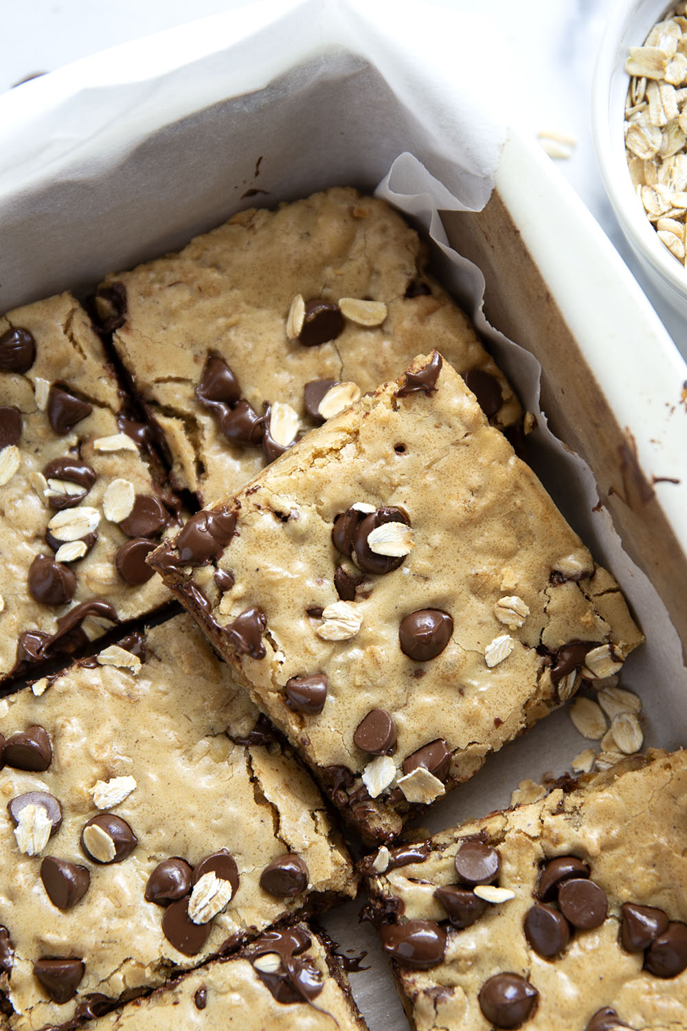 Jam-packed with tender oats and plenty of gooey chocolate, these oatmeal chocolate chip cookie bars have a soft and chewy texture thanks to browned butter and bake up in only 30 minutes.