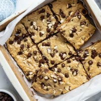 Jam-packed with tender oats and plenty of gooey chocolate, these oatmeal chocolate chip cookie bars have a soft and chewy texture thanks to browned butter and bake up in only 30 minutes.