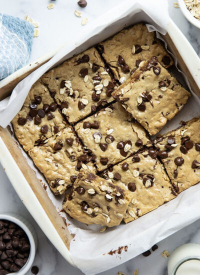Jam-packed with tender oats and plenty of gooey chocolate, these oatmeal chocolate chip cookie bars have a soft and chewy texture thanks to browned butter and bake up in only 30 minutes.