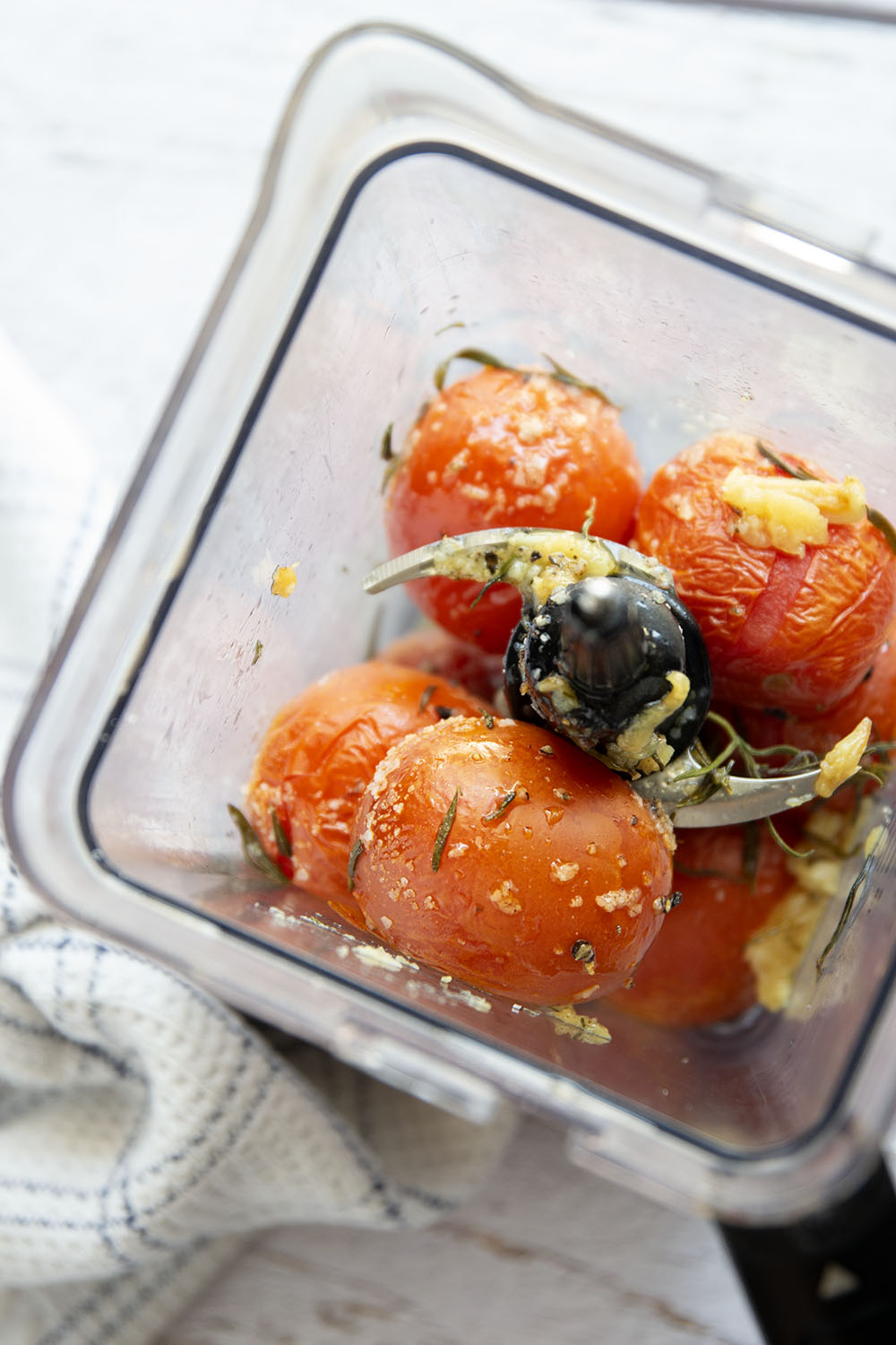Slow-roasted in plenty of herbs and garlic, this roasted tomato sauce packs the absolute BEST flavors of summer! It's incredible with any kind of pasta and you can also freeze it.