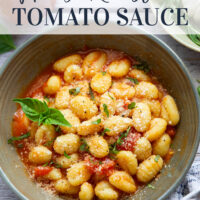 Slow-roasted in plenty of herbs and garlic, this roasted tomato sauce packs the absolute BEST flavors of summer! It's incredible with any kind of pasta and you can also freeze it.