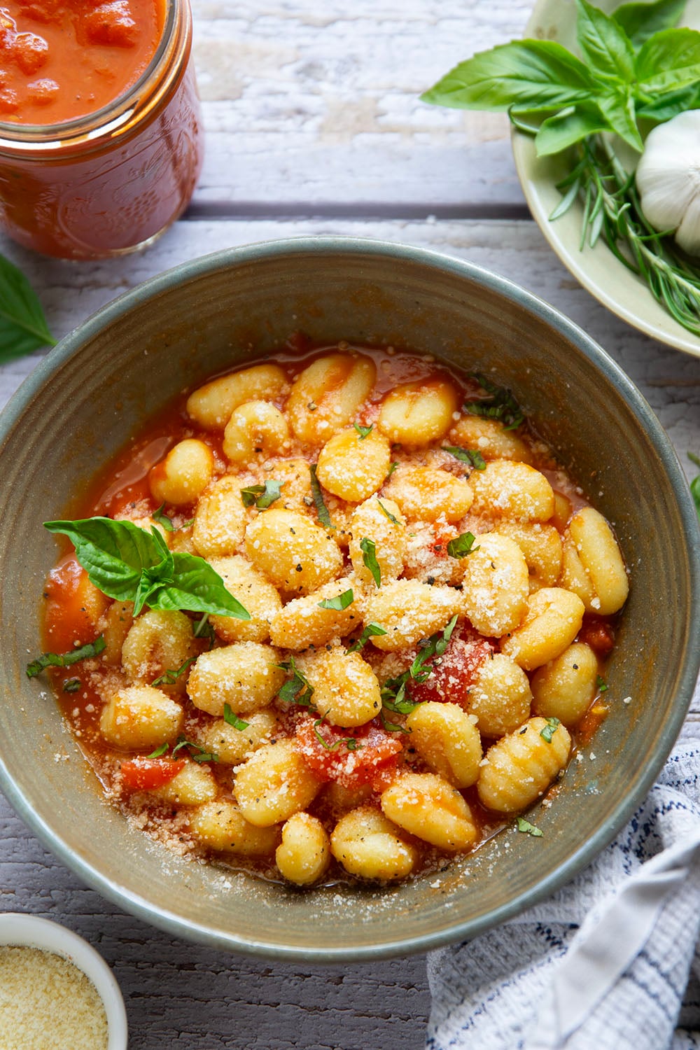 Slow-roasted in plenty of herbs and garlic, this roasted tomato sauce packs the absolute BEST flavors of summer! It's incredible with any kind of pasta and you can also freeze it.