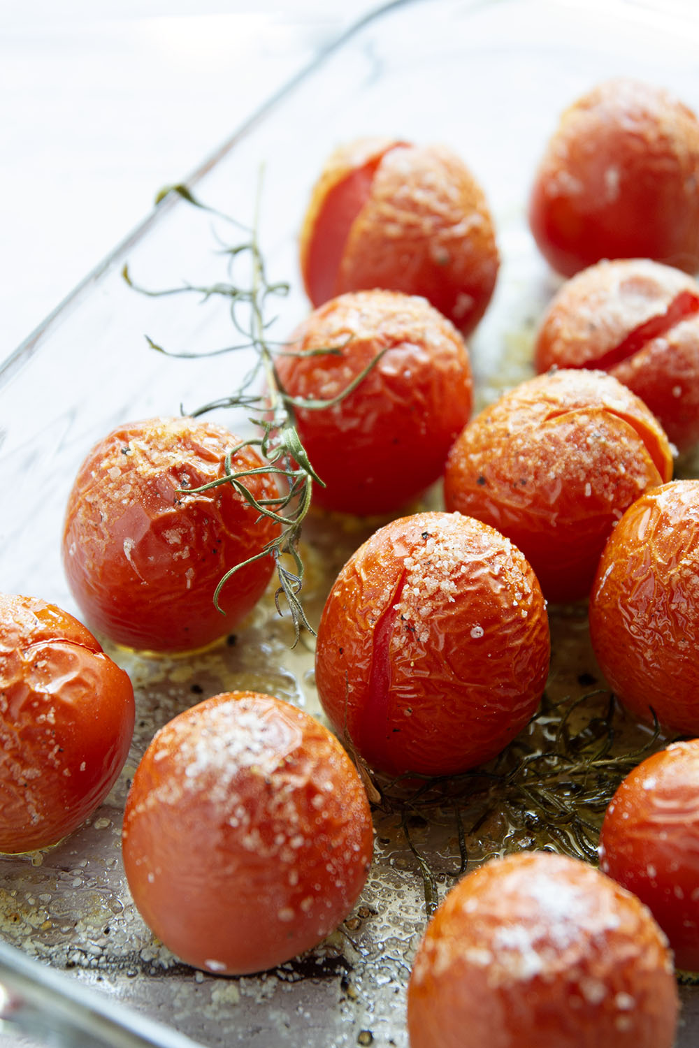 Slow-roasted in plenty of herbs and garlic, this roasted tomato sauce packs the absolute BEST flavors of summer! It's incredible with any kind of pasta and you can also freeze it.