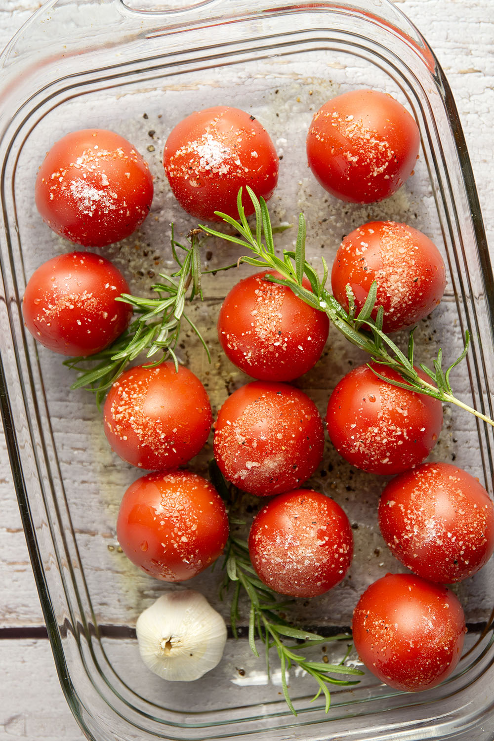 Slow-roasted in plenty of herbs and garlic, this roasted tomato sauce packs the absolute BEST flavors of summer! It's incredible with any kind of pasta and you can also freeze it.