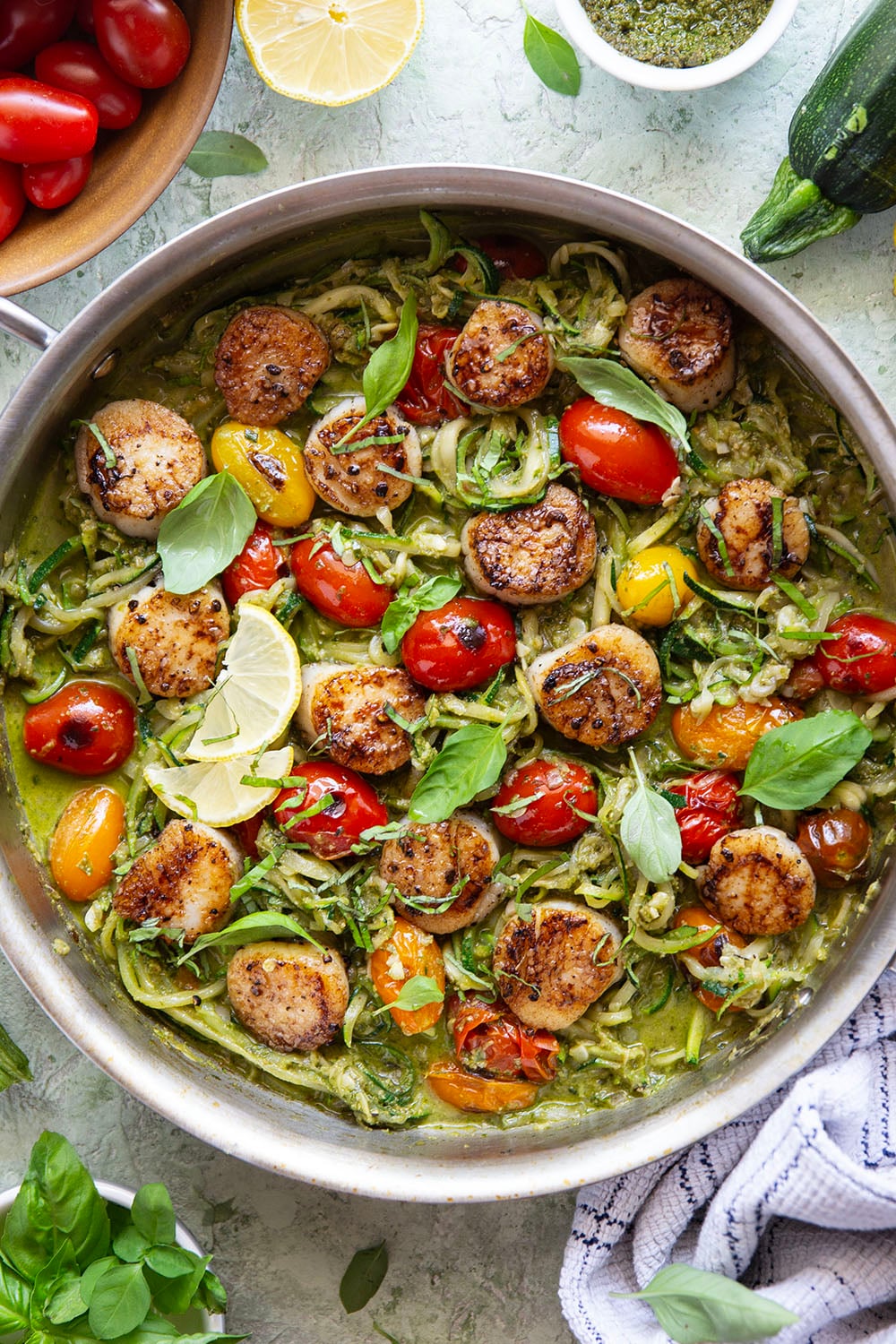 These pesto zucchini noodles come together in minutes with only a handful of summer ingredients and feature lots of flavorful pesto and tender seared scallops on top.
